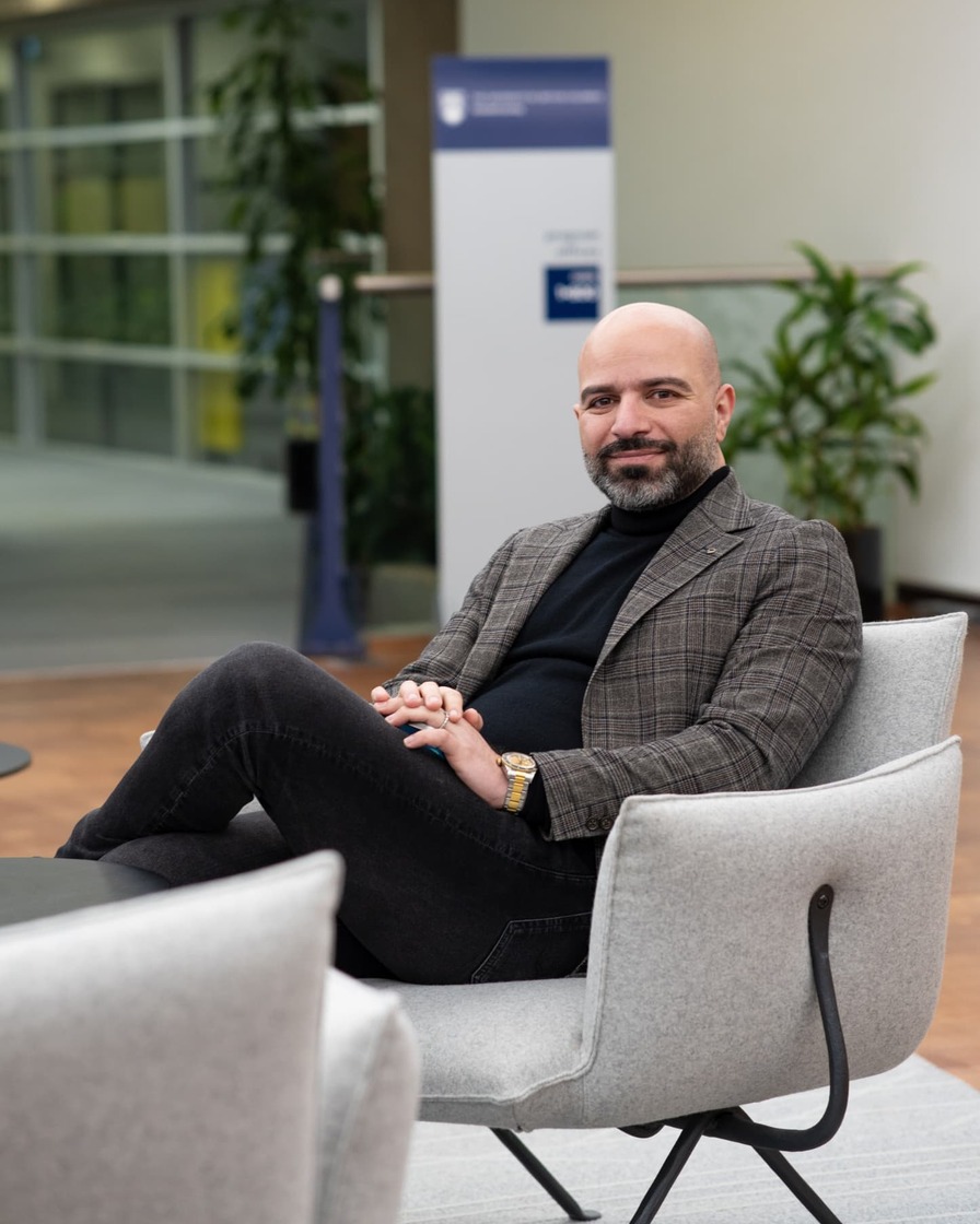 Moe Mohammadi, Co-Founder and Director of Synova, seated in a modern office